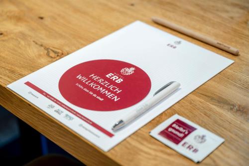 a table with a visa card and a pen on it at Best Western Plus Hotel Erb in Parsdorf