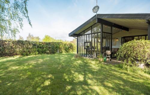 a house with a large yard in front of it at Pet Friendly Home In Nykøbing Sj in Nyrup