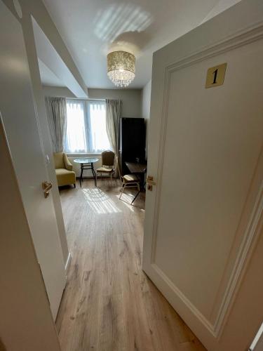 an open door to a living room with a table at Zajazd Arkadia in Siemiatycze