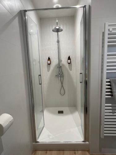 a shower with a glass door in a bathroom at La Millière - Piscine & Campagne - D'Elbée in Le Poiré-sur-Vie