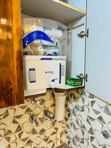 a kitchen with a water boiler in a kitchen at Luxury 1 RK in New Delhi in New Delhi