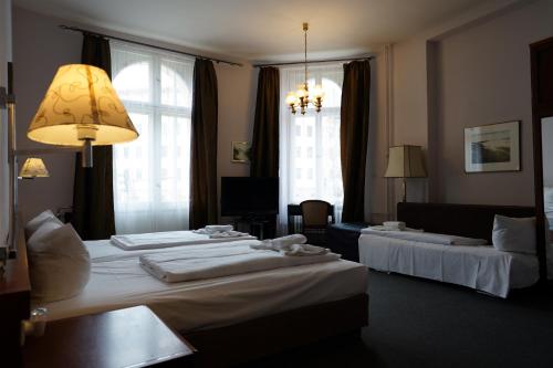 Postel nebo postele na pokoji v ubytování Hotel Xantener Eck