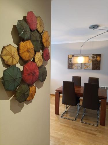 a dining room with a wall of umbrellas at A Devesa in Redondela