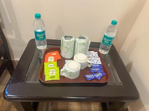 a tray with food and two bottles of water on a table at Shreenivas in Haridwār
