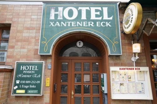 a hotel karmeniererk sign over the door of a building at Hotel Xantener Eck in Berlin