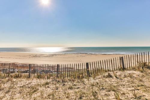 a fence on a beach with the ocean in the background at L'Albatros - 50m plage - Parking in Plage-des-Demoiselles