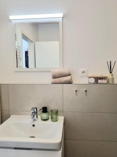 a bathroom with a sink and a mirror at Sleep with the view in Staré Mesto
