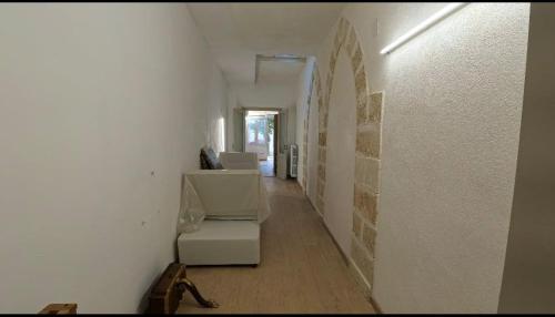 a hallway of a room with a white wall at Casa Scarciglia in Minervino di Lecce