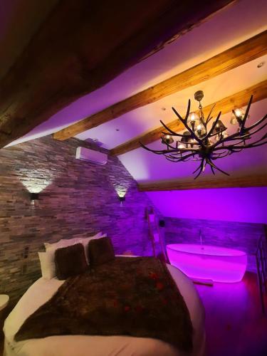 Giường trong phòng chung tại Le Clos des Thermes