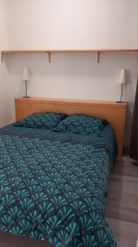Postel nebo postele na pokoji v ubytování Gite chez Anne So