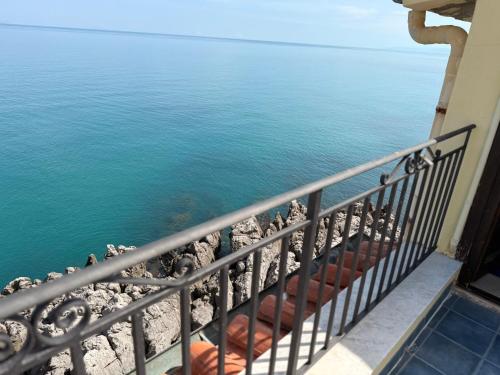a balcony with a view of the water at MiraMare Residence Cefalú in Cefalù