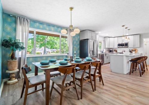 a kitchen and dining room with a table and chairs at Spacious and Luxury Designed Ranch with Game Room in Strongsville