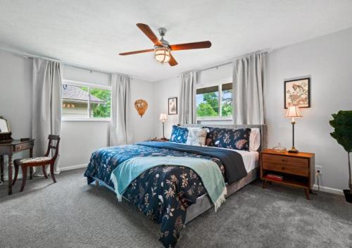 a bedroom with a bed and a ceiling fan at Spacious and Luxury Designed Ranch with Game Room in Strongsville