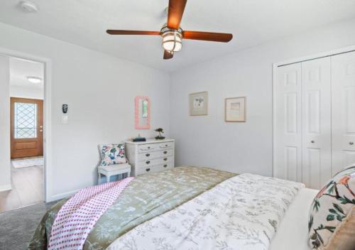 a bedroom with a bed and a ceiling fan at Spacious and Luxury Designed Ranch with Game Room in Strongsville