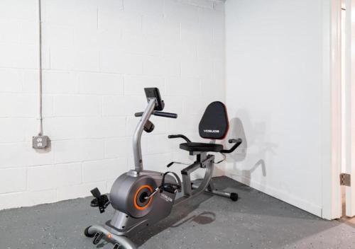 a gym with a exercise bike against a white wall at Spacious and Luxury Designed Ranch with Game Room in Strongsville