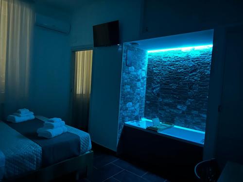 a bathroom with a rock shower and a sink at Mirellas dream in Vibo Valentia