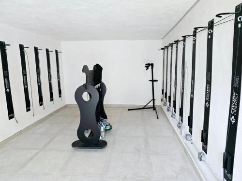 a guitar rack in a room withcussion instruments at Hotel Santanyi Port in Cala Figuera