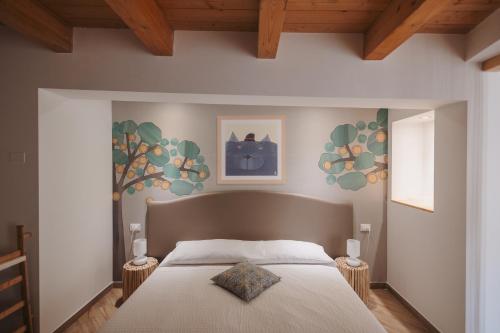 a bedroom with a bed and two night stands at La Casa Di Pinocchio in Enna