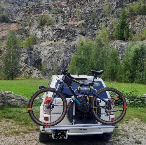 a bike is on the back of a car at Pokoje u ANI Mi in Otmuchów