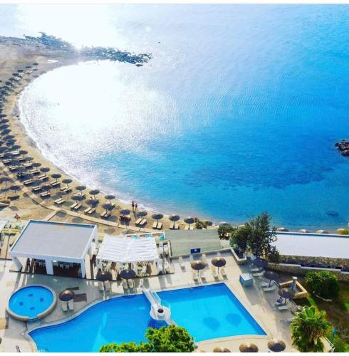 an aerial view of a swimming pool next to a beach at Sunrise Hotel in Pefki Rhodes