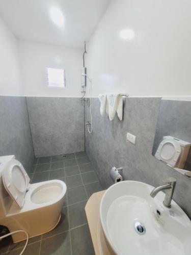 Koupelna v ubytování Capsule Hotel in Malapascua