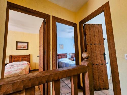 A bed or beds in a room at Alojamientos rurales el hosquillo, lugar de bienestar