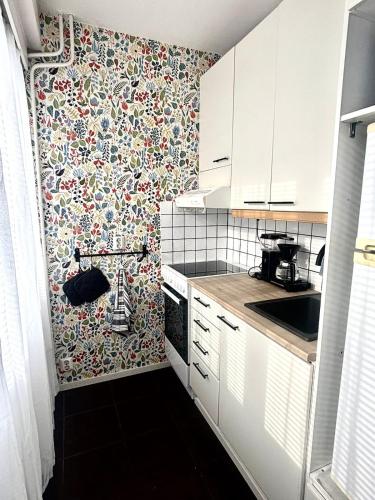 Η κουζίνα ή μικρή κουζίνα στο Cozy apartment in the heart of Pori