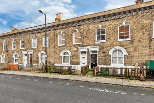 a brick building on the side of a street at Lord's Guesthouse - Room 4 in London
