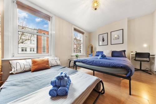 Ένα ή περισσότερα κρεβάτια σε δωμάτιο στο Quadruple - King Room