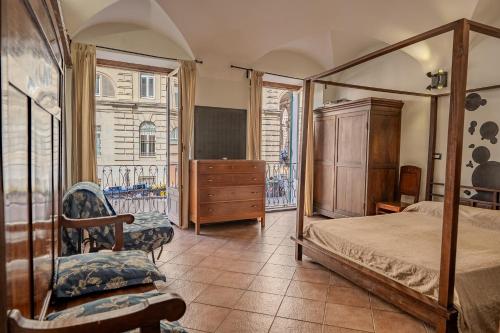 a bedroom with a bed and a dresser and a window at lovingenoa Natural - Light in Genoa