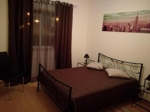 Ένα ή περισσότερα κρεβάτια σε δωμάτιο στο T2 Alto Quintão