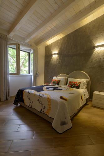 a bedroom with a large bed in a room at Luluxuryhouse in Trevignano Romano