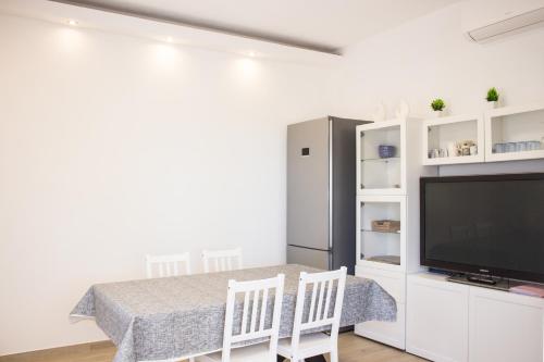 TV a/nebo společenská místnost v ubytování Casa Mondes