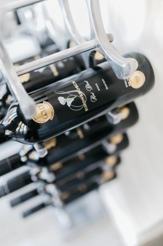 a bunch of bottles of wine in a wine rack at Bloemenzee Boutique B&B in Gordonʼs Bay