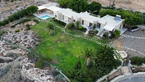 an aerial view of a large white house at Amatu Villa (Athena) in Xerokampos