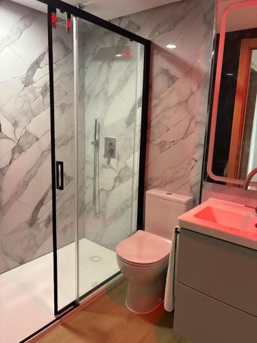 a bathroom with a shower and a toilet and a sink at Sea and Mountains in Gran Alacant
