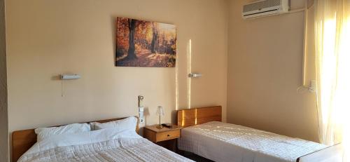 Postel nebo postele na pokoji v ubytování K SANTIS STUDIOS