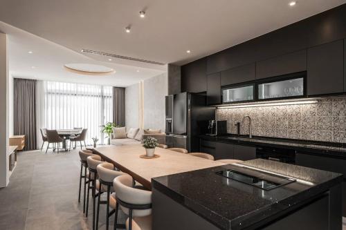 a kitchen and dining room with a table and chairs at KK Villa in Dongshan
