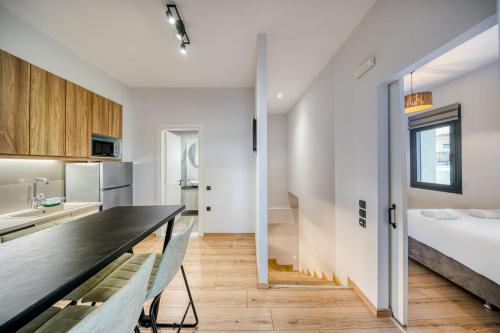 Ένα ή περισσότερα κρεβάτια σε δωμάτιο στο Windmill Escape Apartments A