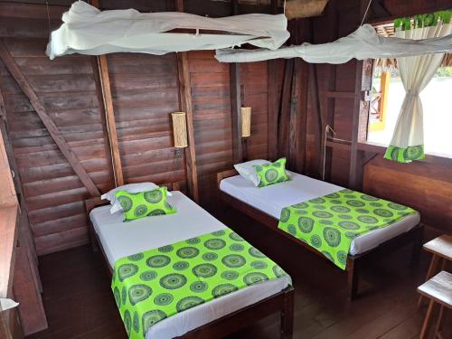 Katil atau katil-katil dalam bilik di Lakana Hotel