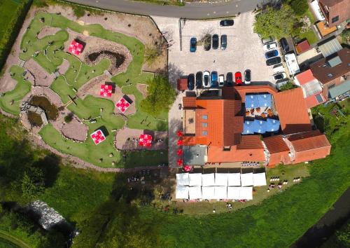 an aerial view of a house with a garden at Landhotel Kahltalmühle in Alzenau in Unterfranken