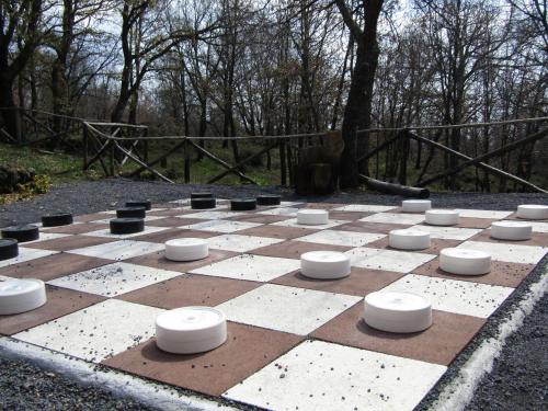 a checkerboard chessboard in the middle of a park at Boscoscuro in Ragalna