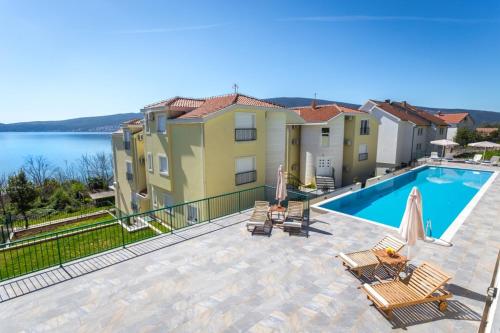 a view of a swimming pool from a house at Adriadome Apartments in Bijela