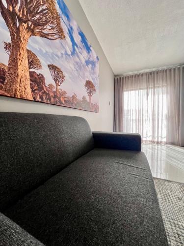 Ένα ή περισσότερα κρεβάτια σε δωμάτιο στο Hillside Executive Accommodation