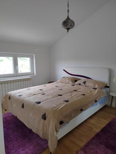 Postel nebo postele na pokoji v ubytování Lux Apartman Banjica
