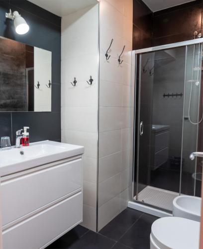 a bathroom with a sink and a shower at B&B Sweet Sleep in Naples