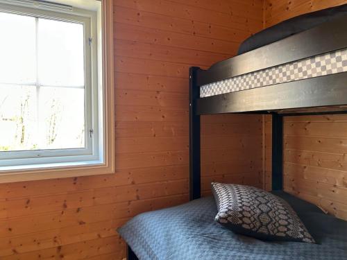 Ένα ή περισσότερα κρεβάτια σε δωμάτιο στο Cozy cabin in Eikedalen