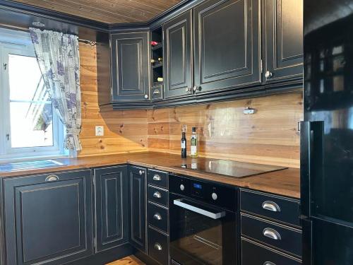 Η κουζίνα ή μικρή κουζίνα στο Cozy cabin in Eikedalen
