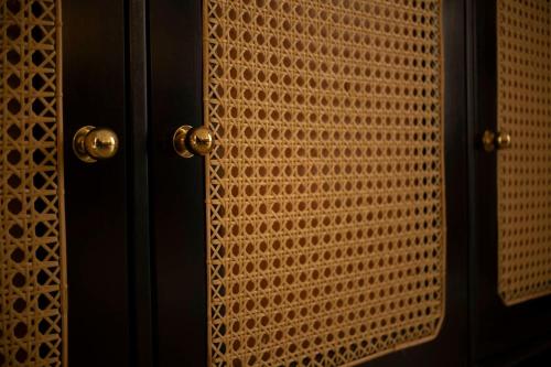 a close up of a wooden door with a window at IGN Residence Colombo in Colombo