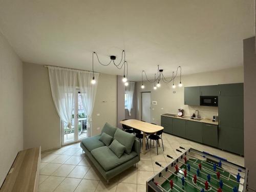 a living room with a couch and a table at Cinelli Apartment Stio Cilento in Magliano Nuovo